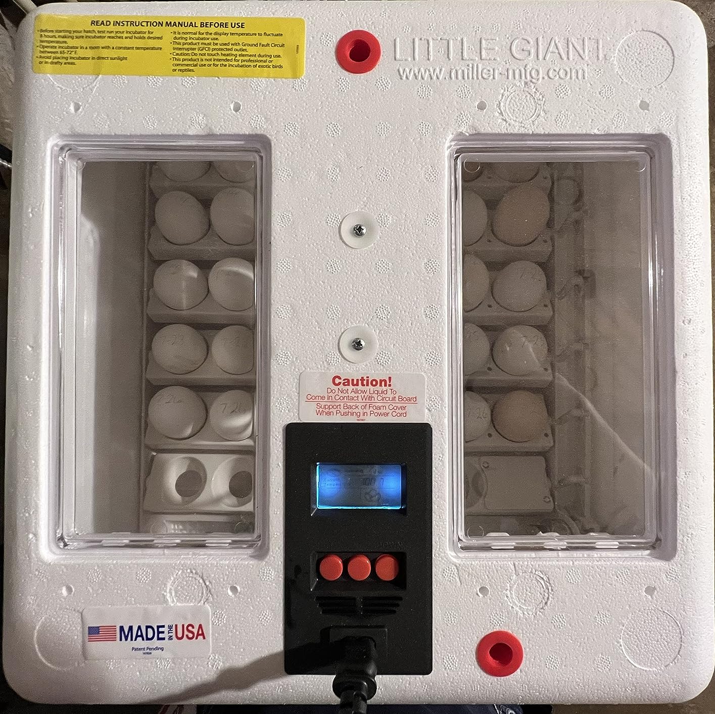 Little Giant incubator lid with the digital controller lit and eggs visible through both viewing windows